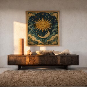 Celestial sun and moon wall art print hanging above a dark wood console and jute rug in a warm neutral interior.