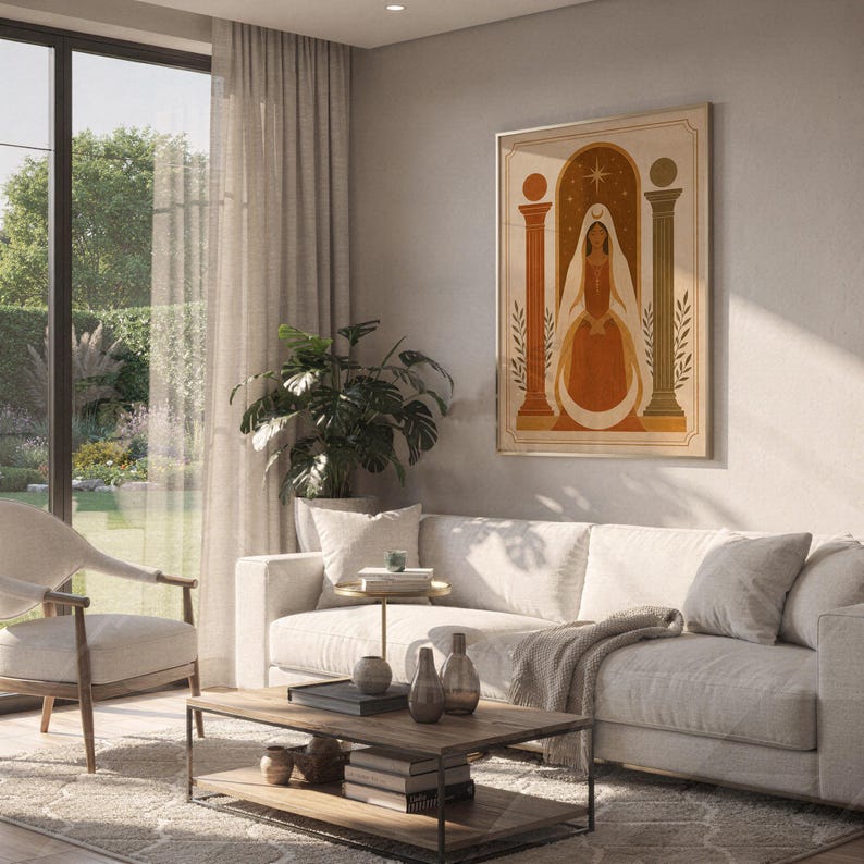 Bohemian terracotta arch art print hanging on a bright living room wall above a modern beige couch and houseplants.
