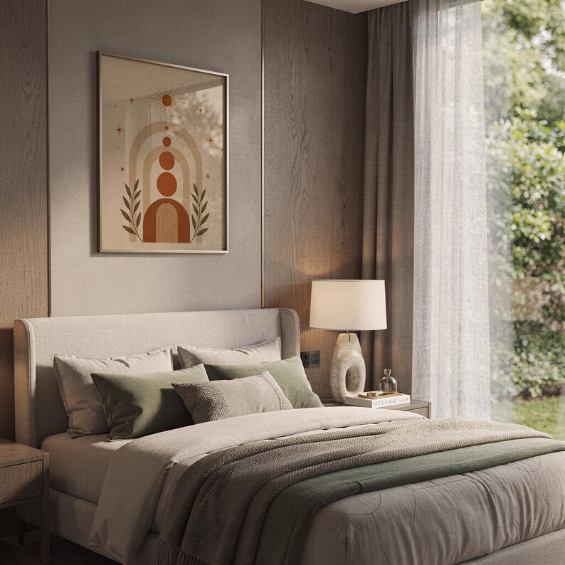 Boho arch and botanical leaves print hanging above cozy bed in aesthetic bedroom decor.