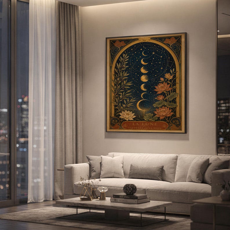 Moon phase wall art print hanging above a light gray sofa in a modern living room with evening city views through tall windows.