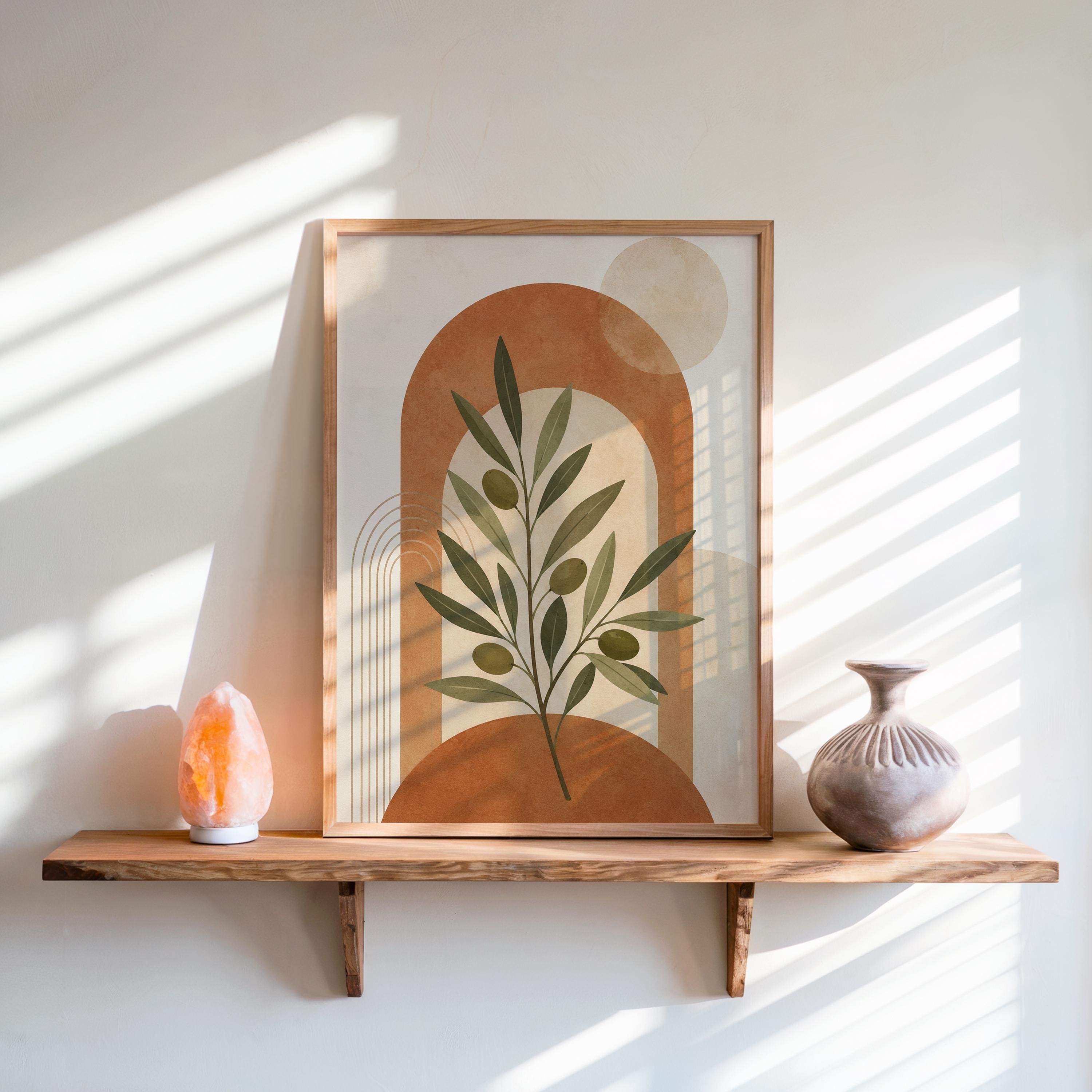 Olive branch art with terracotta arch framed on rustic wooden shelf in sunlit room
