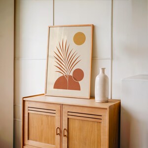 Boho terracotta palm leaf print set on vintage wooden sideboard console