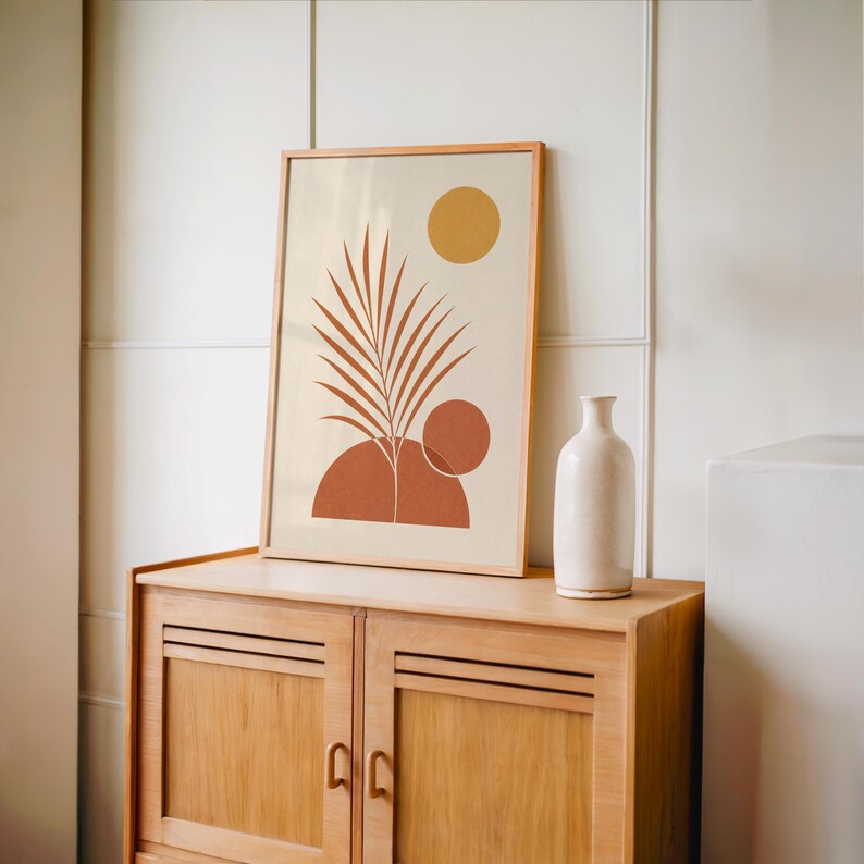 Boho terracotta palm leaf print set on vintage wooden sideboard console