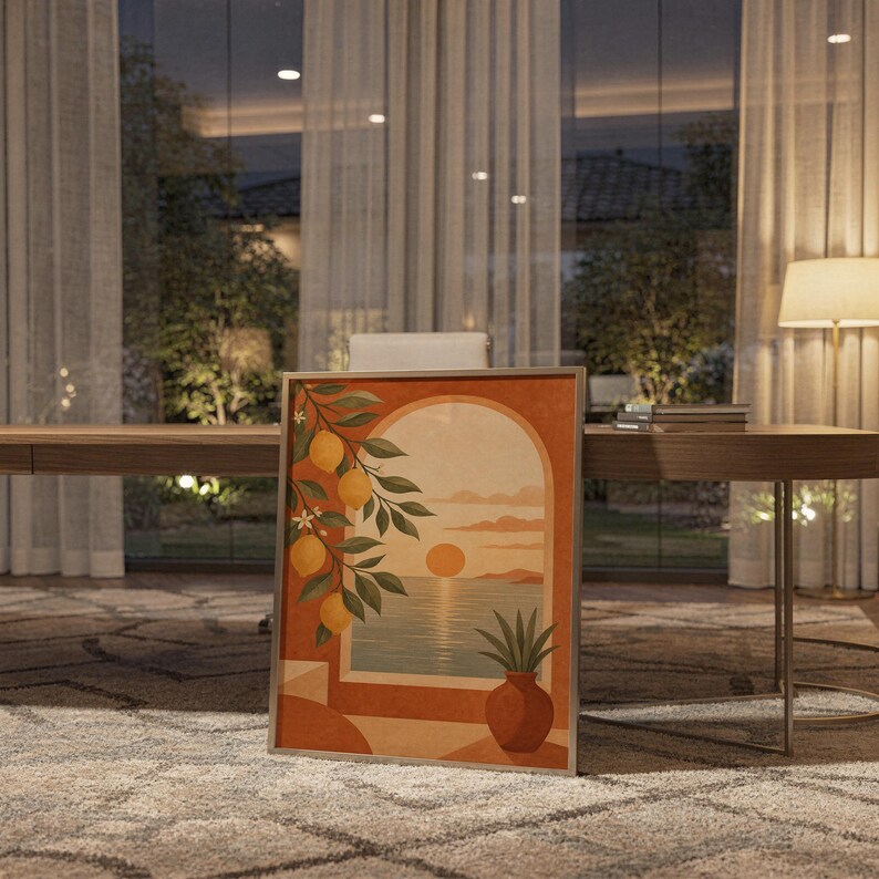 Mediterranean lemon and sea view arch print standing on a wooden desk in a home office in warm evening light.