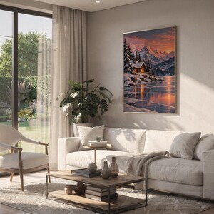 Winter cabin mountain wall art print hanging above a white sofa in a living room with garden views.