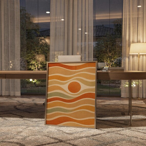 Abstract wavy sun print standing on a wooden desk in a home office in warm evening light.