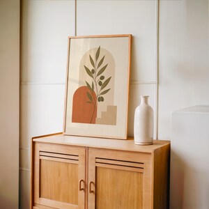 Japandi style botanical art framed on vintage wooden sideboard console