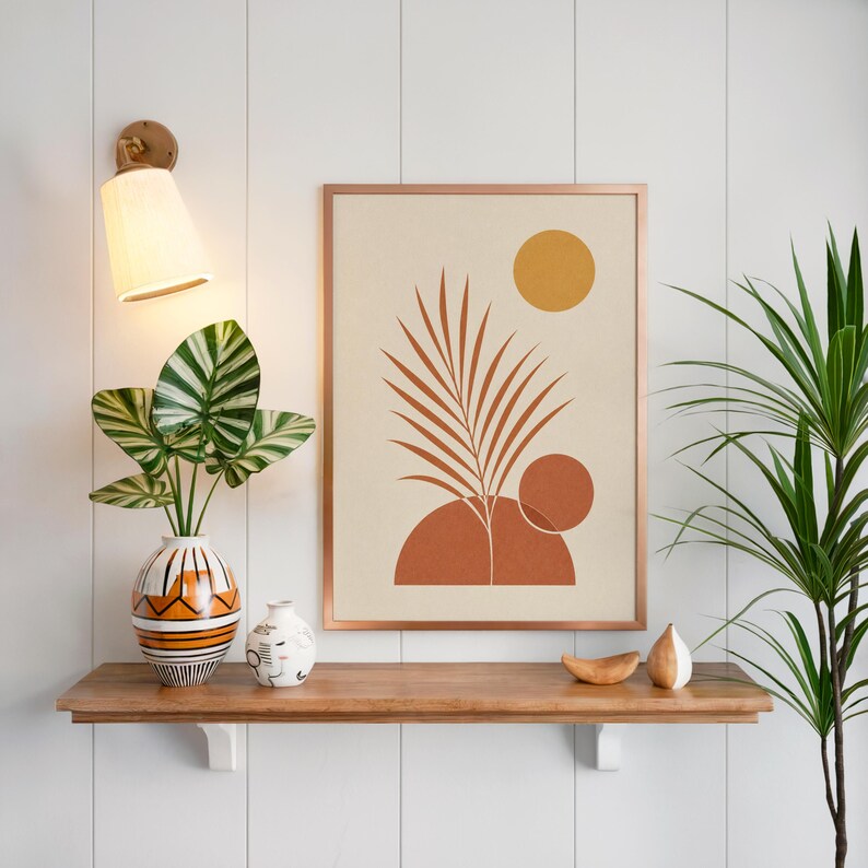 Boho palm leaf wall art on floating wooden shelf above lush green houseplants