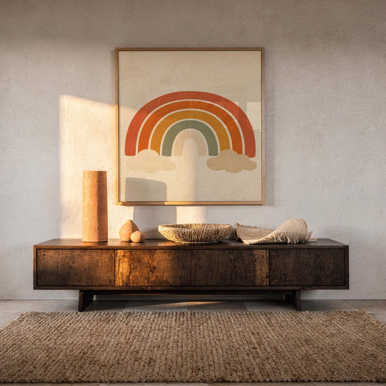 Boho earth tone rainbow print hanging above a dark wood console and jute rug in a warm neutral interior.