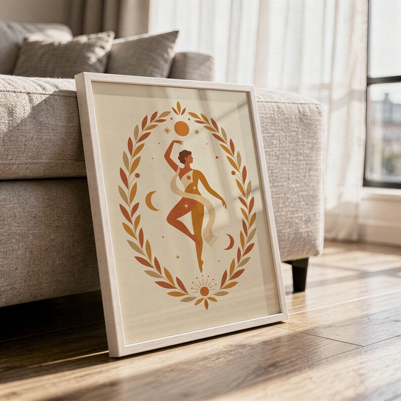 Spiritual divine feminine wall art in a sleek frame resting on the floor against a sofa with natural sunlight shadows.