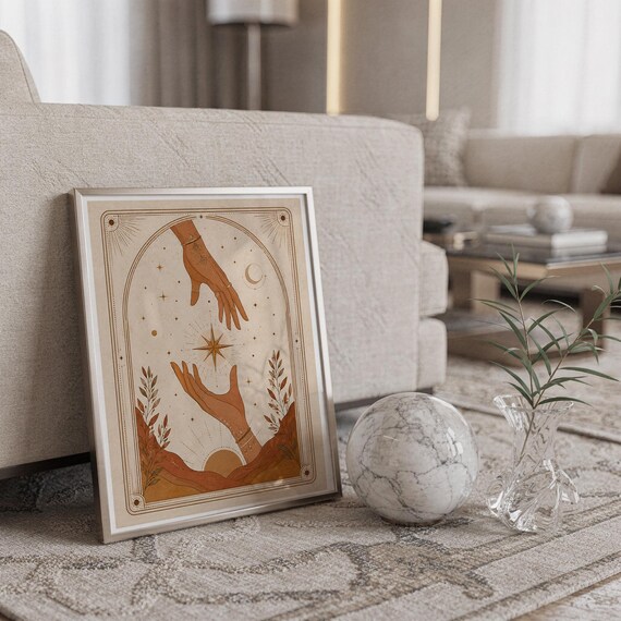 Spiritual star tarot poster framed on carpet floor next to crystal ball decor in home.