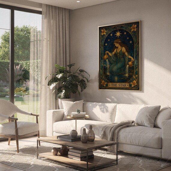 The star tarot card wall art print hanging above a white sofa in a living room with garden views.