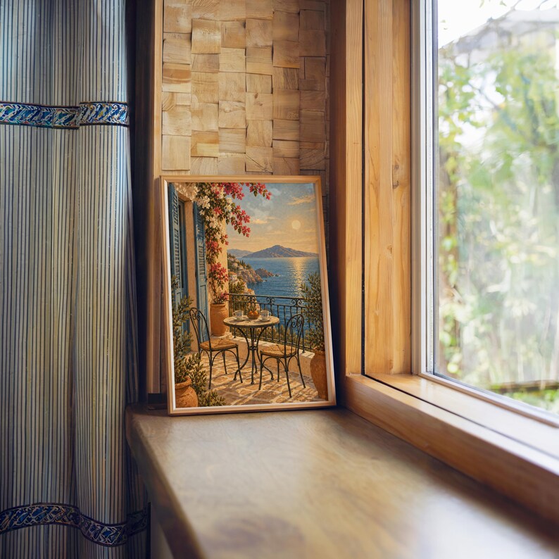 Mediterranean balcony wall art print standing on a wooden window sill in warm natural light.