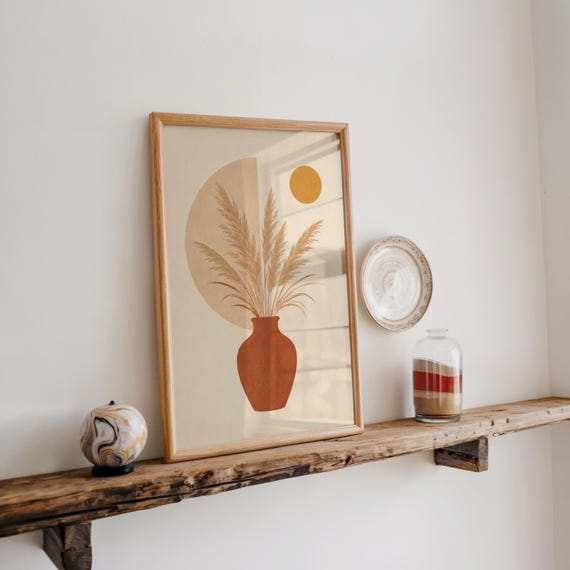 Terracotta vase botanical poster resting on rustic wooden wall shelf