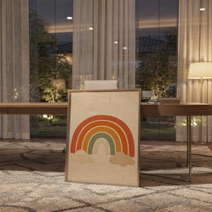 Boho earth tone rainbow print standing on a wooden desk in a home office in warm evening light.