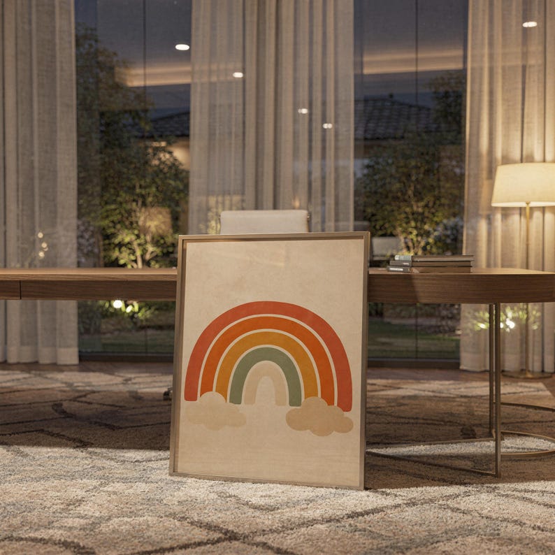 Boho earth tone rainbow print standing on a wooden desk in a home office in warm evening light.