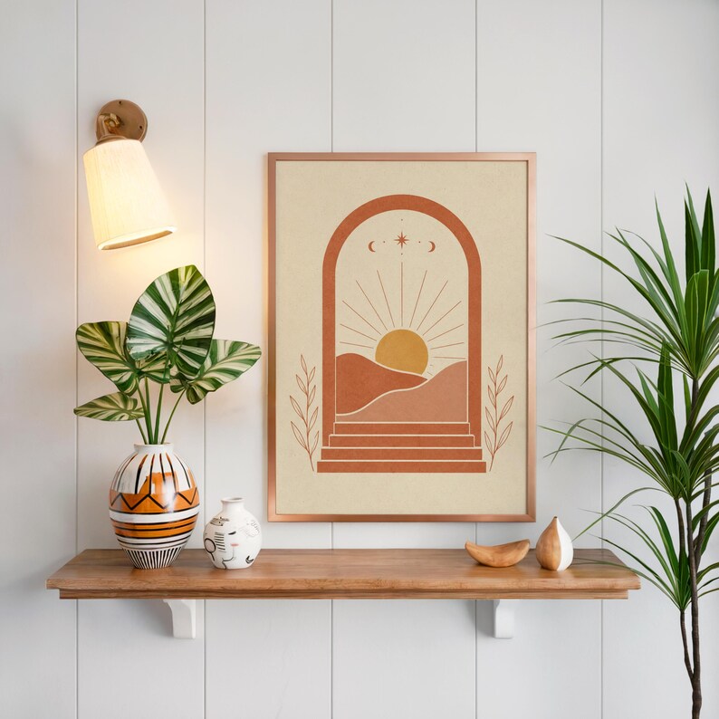 Boho desert wall art on floating wooden shelf above indoor green plants