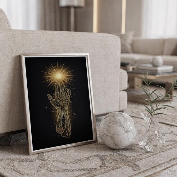 Celestial hand wall art print standing on a countertop in a modern white kitchen.