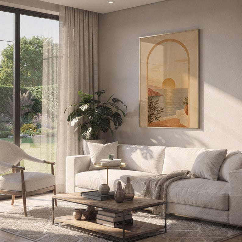 Mediterranean sunset arch print hanging above a white sofa in a living room with garden views.