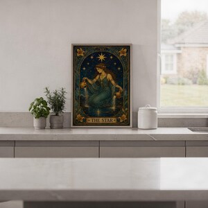 The star tarot card wall art print hanging in a high-rise apartment living room with a city skyline view.