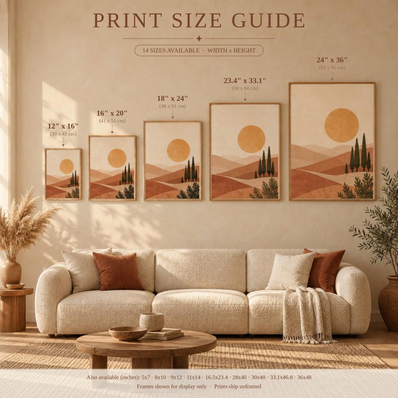 Snowy mountain village wall art print leaning on a wooden desk against a warm beige wall in soft window sunlight.