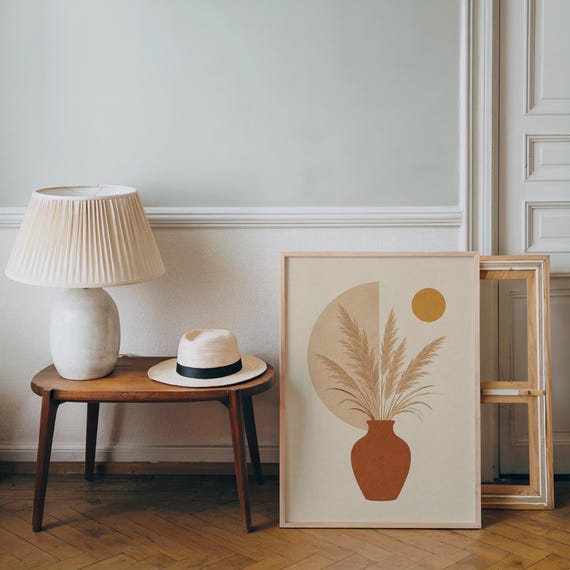 Boho botanical print resting on wooden side table in bright living room