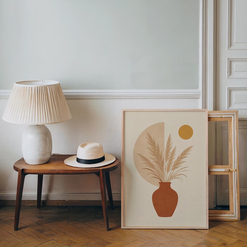 Boho botanical print resting on wooden side table in bright living room