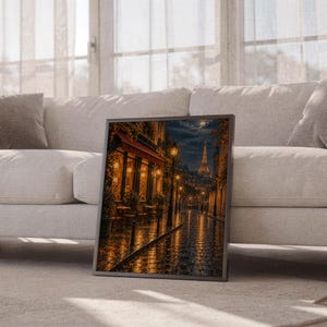 Paris eiffel tower wall art print leaning against a white sofa in a bright living room with sheer curtains.