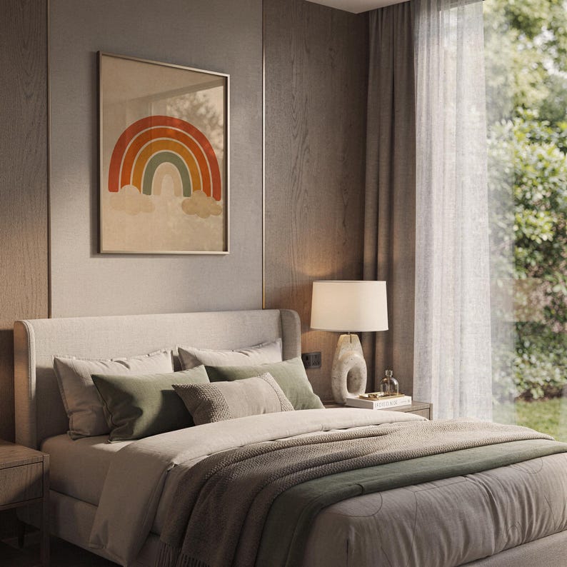 Boho earth tone rainbow print hanging above a bed with sage green pillows in a calm neutral bedroom.