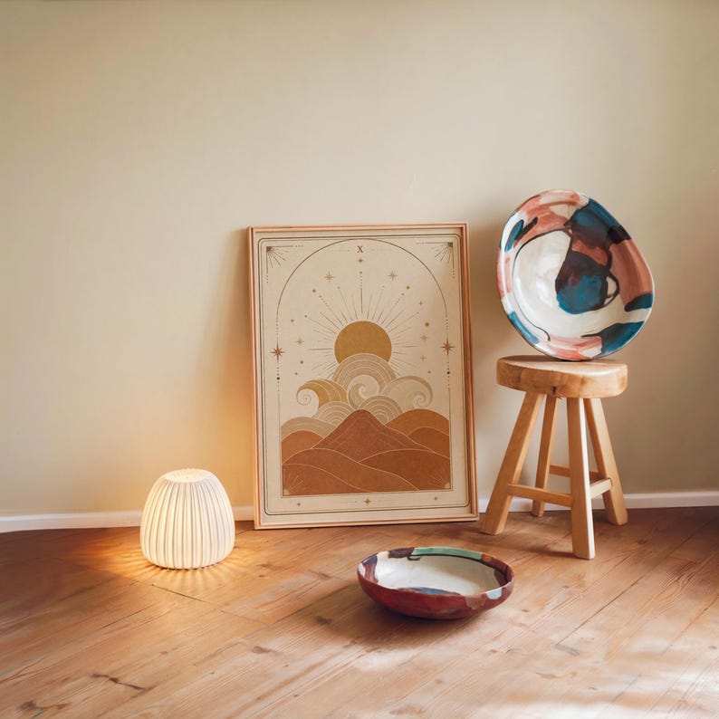 Minimalist neutral wall art poster framed on wooden floor with ambient night lamp.