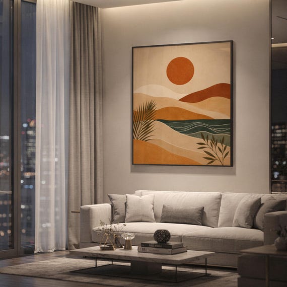 Framed modern abstract desert landscape art hanging above a sofa in a contemporary high rise apartment.