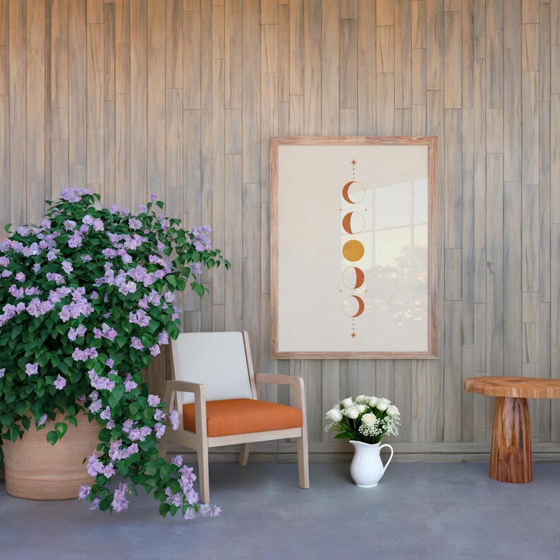 Terracotta moon phases print in spacious living room with armchair and potted plant