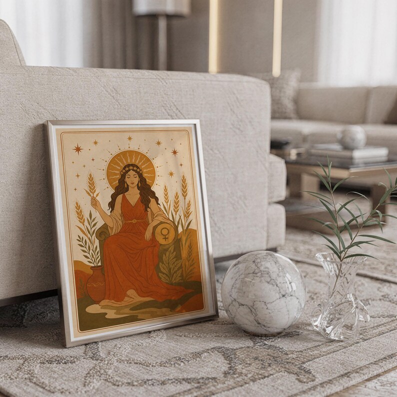 Celestial goddess wall art print standing on a countertop in a modern white kitchen.