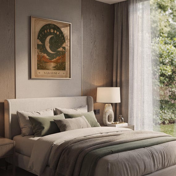 Boho celestial moon tarot card wall art hanging above cozy bed in aesthetic bedroom decor.