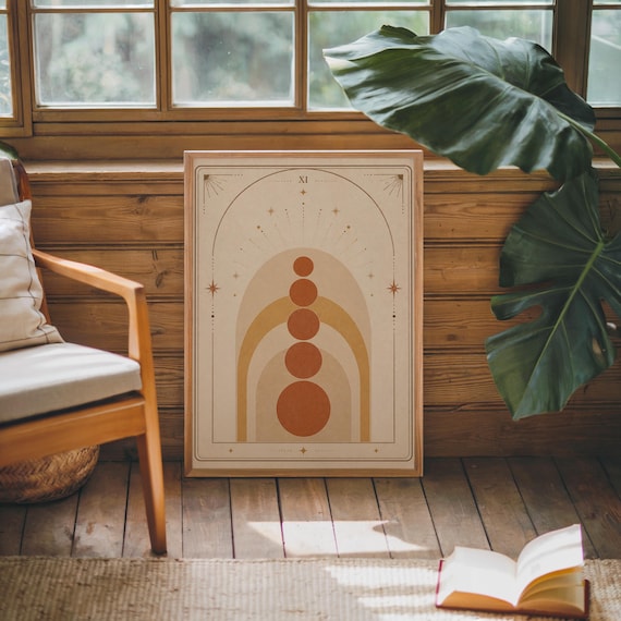 Modern boho arch poster framed in cozy rustic room with green indoor plants.