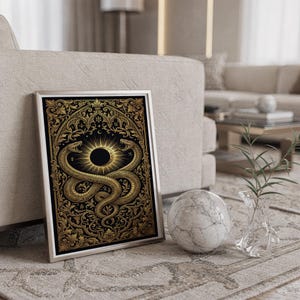 Occult snake wall art print standing on a countertop in a modern white kitchen.