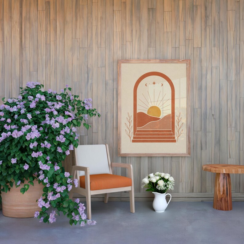 Terracotta landscape poster in cozy living area with orange armchair and plants