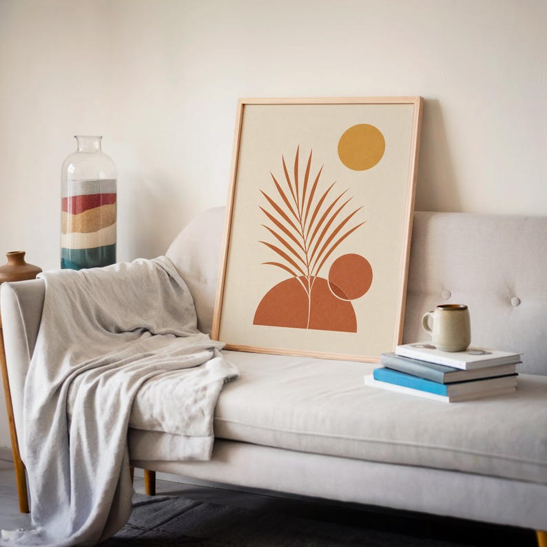 Terracotta botanical leaf print leaning against wall on sofa in cozy interior