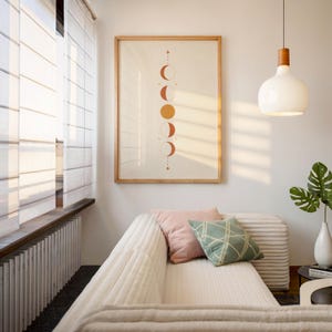 Boho moon phases wall art displayed in sunlit cozy interior living room