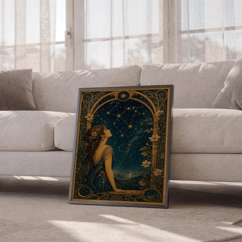 Celestial woman wall art print leaning against a white sofa in a bright living room with sheer curtains.