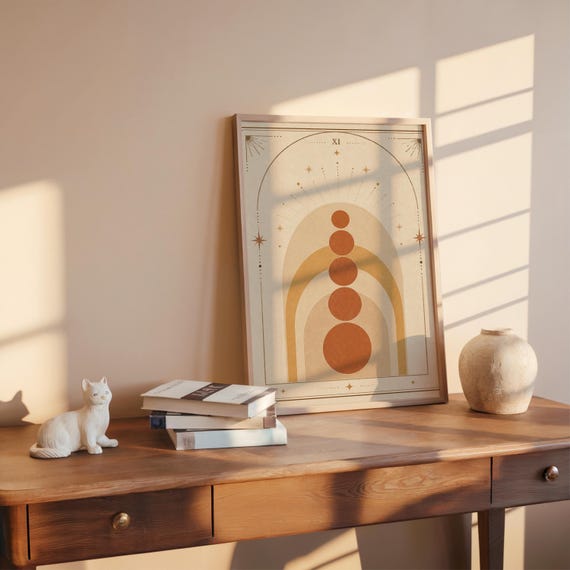 Minimalist boho arch wall art poster on wooden desk with warm sunlight and ceramic vase.
