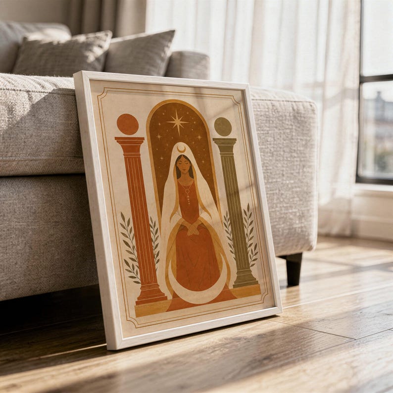 Abstract terracotta pottery wall art in a wooden frame resting on the floor with soft natural sunlight and shadow patterns.