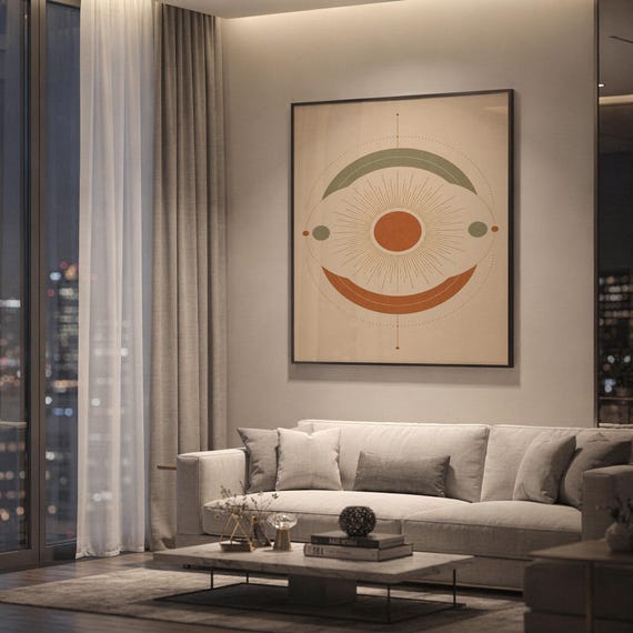 Abstract sun wall art print hanging above a light gray sofa in a modern living room with evening city views through tall windows.
