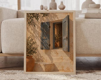 Op de afbeelding: Een ingelijste muurkunstprint met een gestructureerde beige stucmuur en een open raam met verweerde blauwe houten luiken. Een terracotta pot met een kleine groene plant staat op de grond, terwijl schaduwen van olijftakken over de muur vallen.