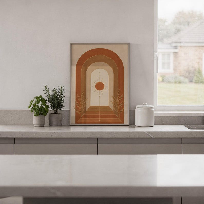 Boho arch sun wall art print hanging in a high-rise apartment living room with a city skyline view.