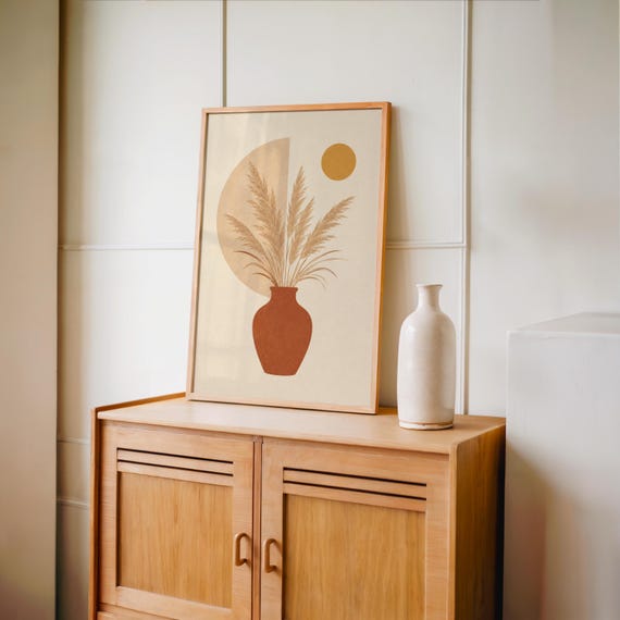 Minimalist pampas grass poster set on vintage wooden sideboard console