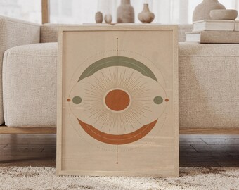 Puede incluir: Una lámina de arte rectangular enmarcada que presenta un círculo naranja central rodeado de finas líneas radiantes. El diseño incluye un arco verde salvia arriba y un arco naranja quemado abajo, con puntos sobre un fondo beige en un marco de madera clara.