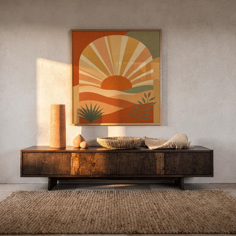 Boho sun arch print hanging above a dark wood console and jute rug in a warm neutral interior.