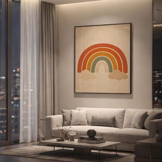 Boho earth tone rainbow print showing a layered rainbow arches with soft beige clouds in terracotta, burnt orange, mustard, sage and cream, hanging above a light gray sofa in a modern living room with evening city views through tall windows.