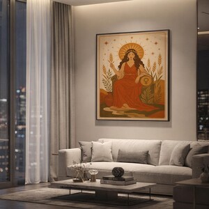 Celestial goddess wall art print hanging above a light gray sofa in a modern living room with evening city views through tall windows.